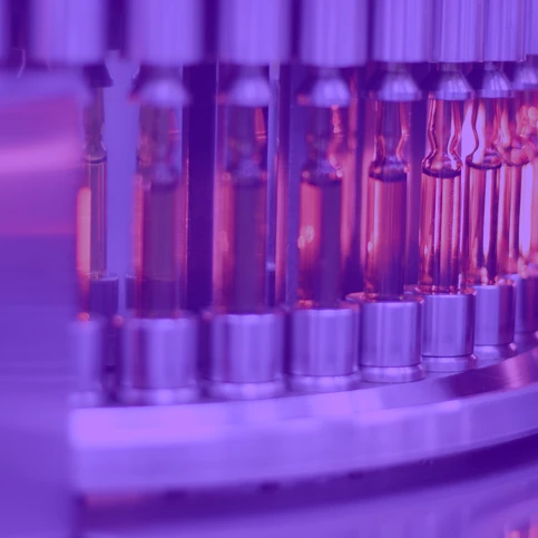 Image showing a vial inspection machine with a purple transparent foreground color.