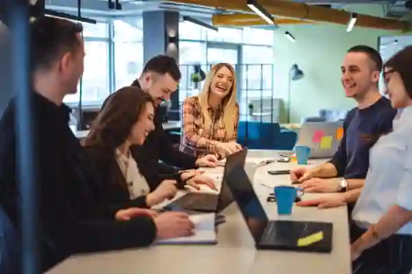 Group of young professionals, working on an assignment at a table.