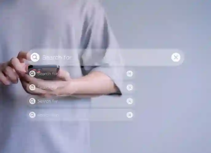 Man in t-shirt browsing products on a cellphone, on a grey background, with a transparent search bar as an overlay to the background image.